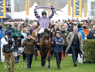Stage Star after winning at the Cheltenham Festival with Harry Cobden and Paul Nicholls (right) - 16 March 2023