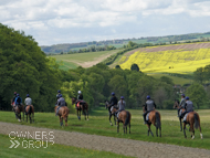 Nickleby (white cap) taking in the views from Charlie Hills' gallops - 19 May 2021